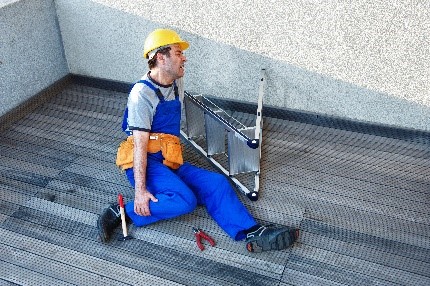 A Person in a hardhat on the ground