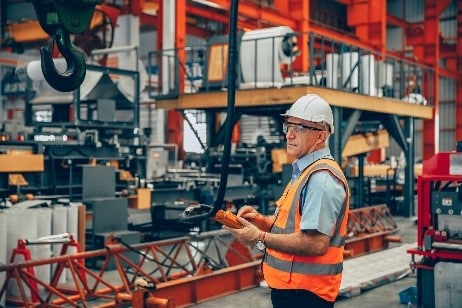 Man operating overhead crane